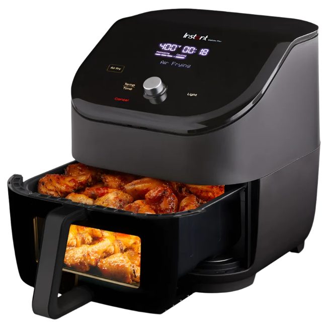 Instant Vortex Plus ClearCook air fryer with its basket pulled out, chicken wings visible through the basket's front window