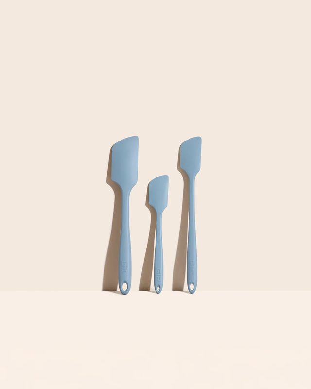 Three slate blue GIR silicone spatulas of different sizes standing upright
