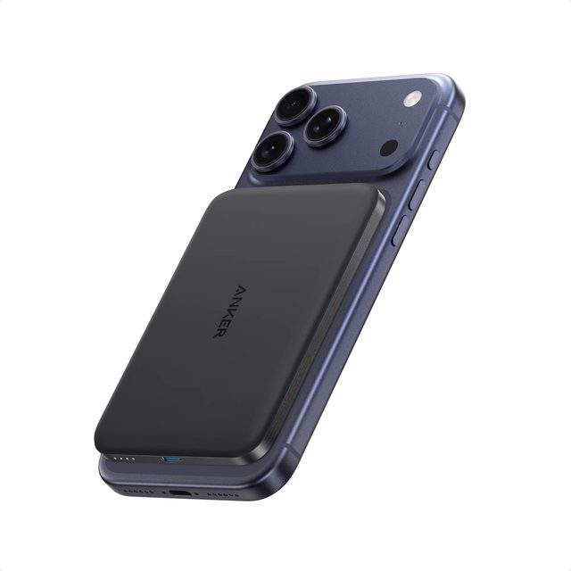 Black Anker Nano 5K MagGo Slim power bank attached magnetically to the back of a blue iPhone