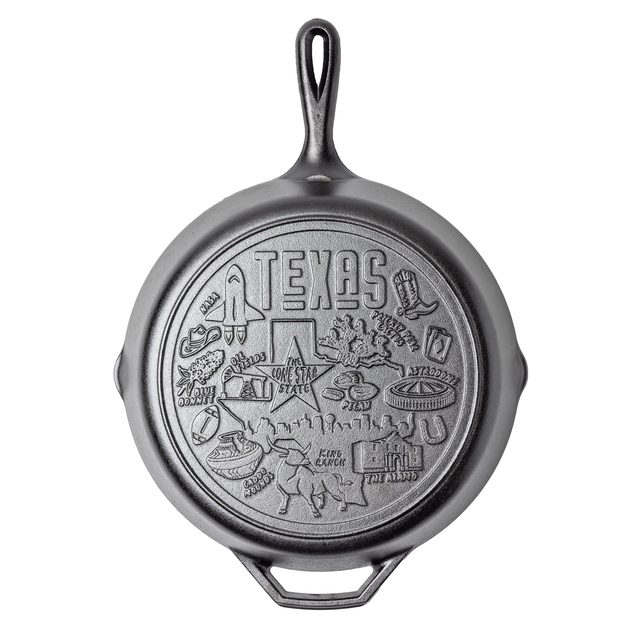 A Lodge 12 inch cast iron skillet with a Texas design cast into the cooking surface: the Alamo, a rocket and a cowboy boot