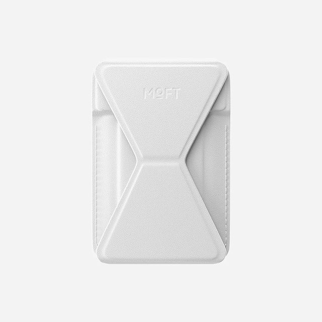 A white MOFT phone wallet with its fold-out stand panel, seen from the back