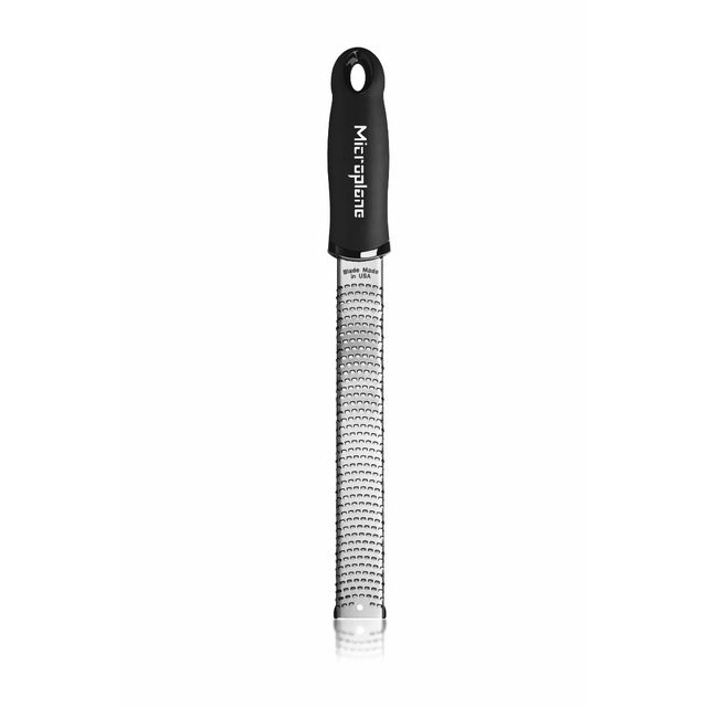 The long, narrow Microplane Premium Classic zester with a black soft-touch handle